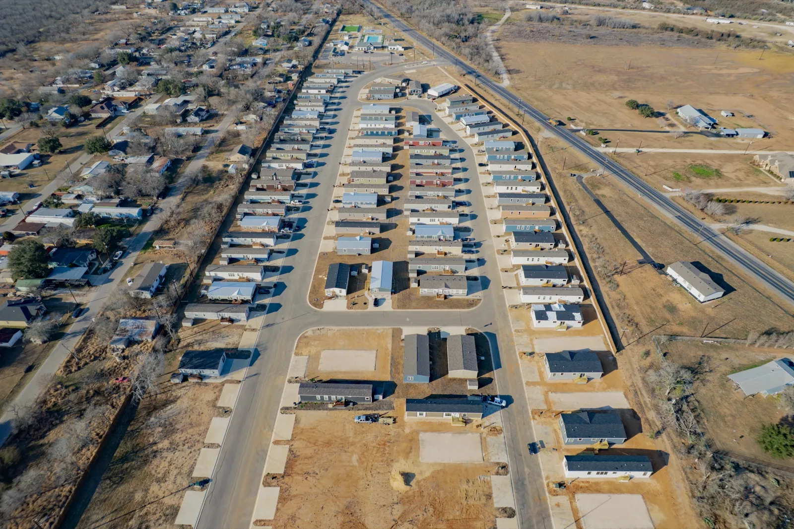 Aerial view of streets and completed homes at The Reserve at Flores Valley