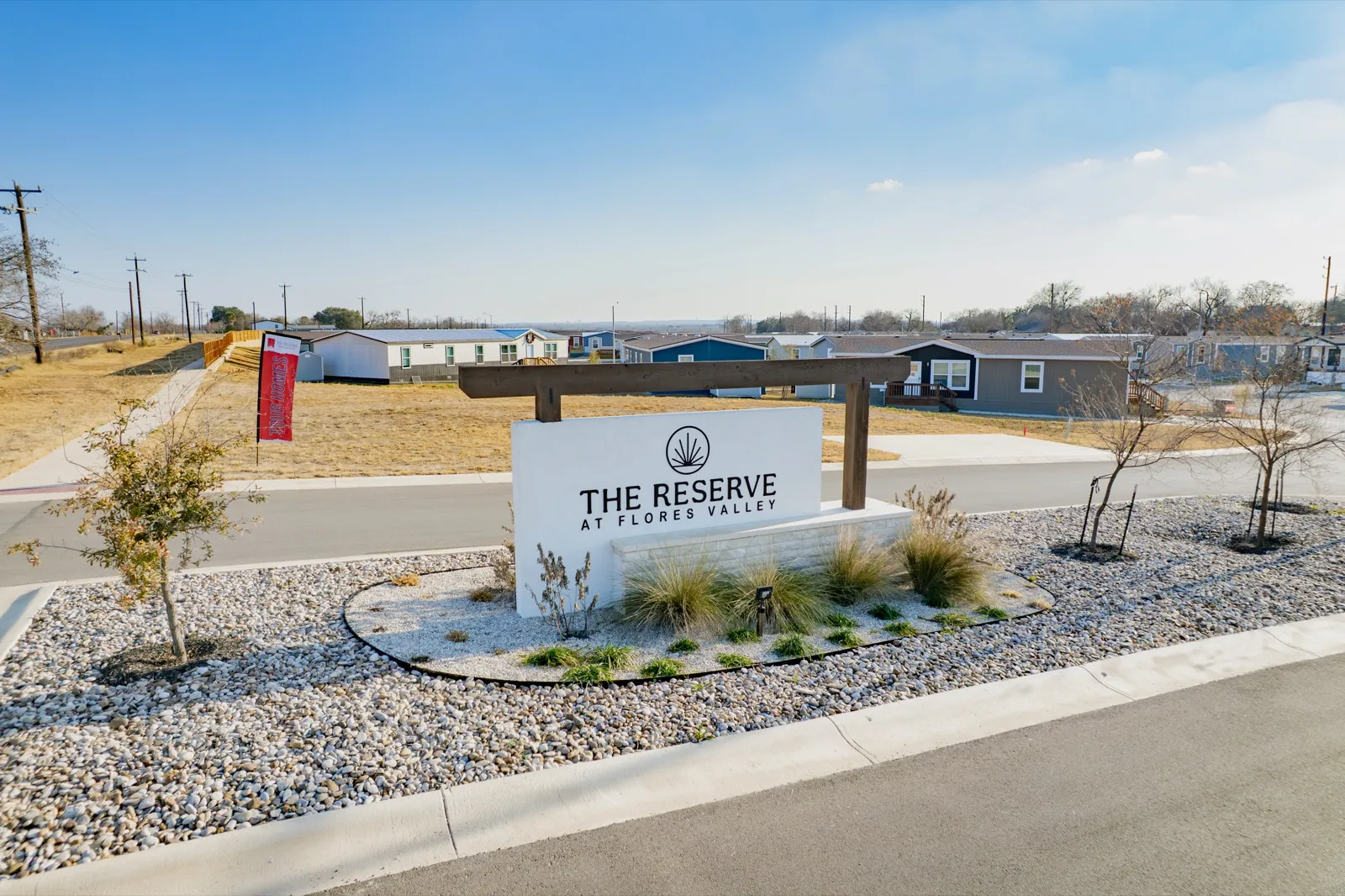 Entrance monument sign of The Reserve at Flores Valley